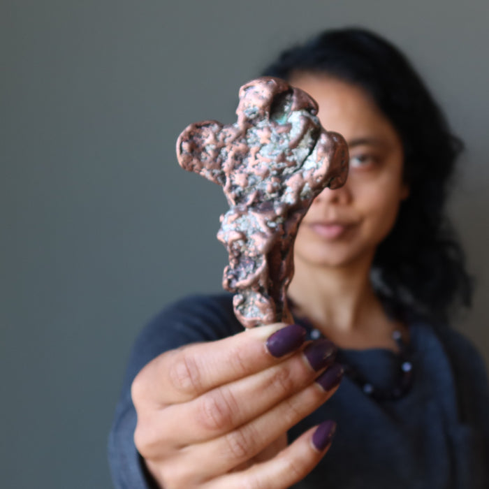 sheila of satin crystals holding Raw Copper Metal Sculpture