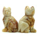 calico yellow agate cats facing opposite direction