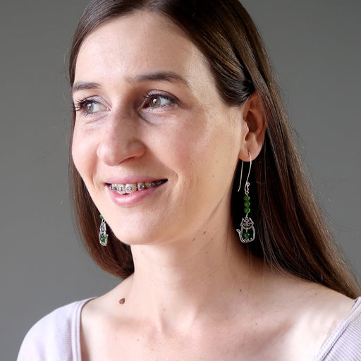 female model wearing sterling silver cat and green diopside gemstone earrings