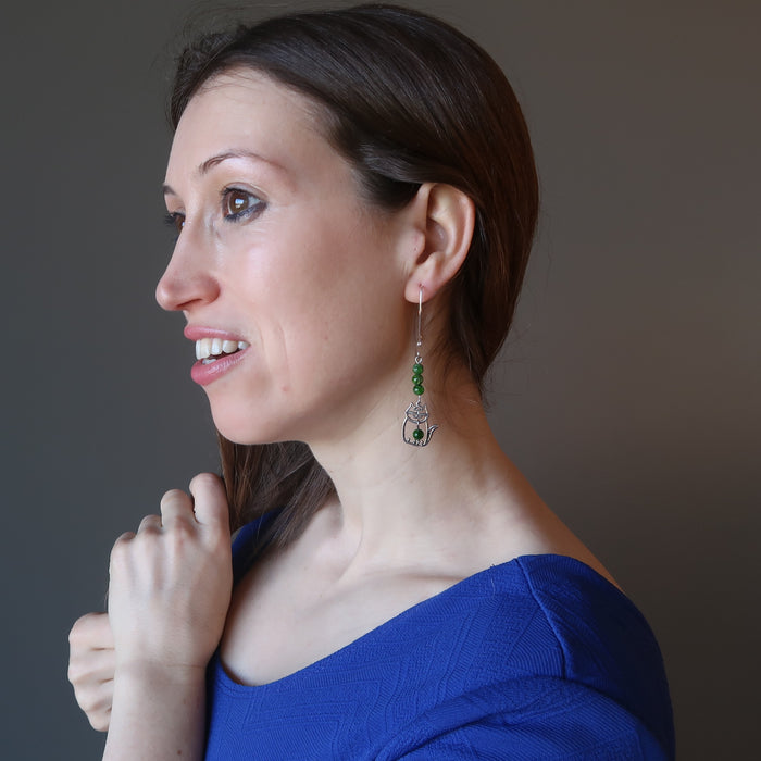 female model wearing sterling silver cat and green diopside gemstone earrings