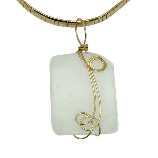 wavy rectangle white Dolomite stone wrapped in gold plated wire pendant hangs on Gold plated choker 
