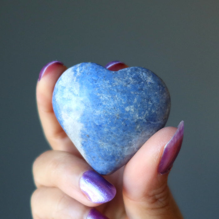 hand holding dumortierite crystal heart