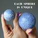 holding blue Dumortierite Spheres one on each hand