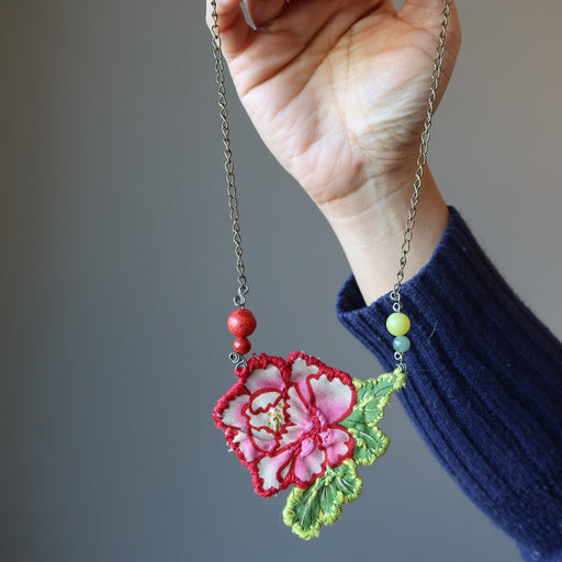 hand holding Red Coral Green Aventurine Serpentine Flower Embroidered Necklace 