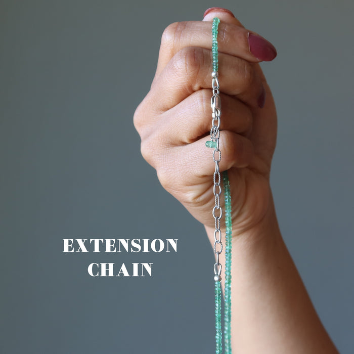 hand holding Emerald Necklace showing extension chain