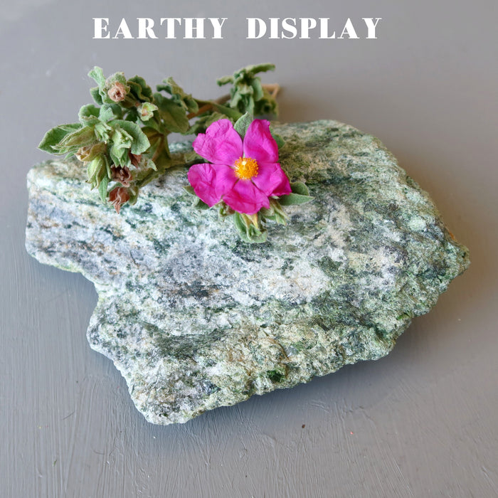 rough green epidote standing mineral stone with pink flowers
