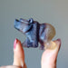 fingers holding  Carved Rainbow Fluorite Bear Statue