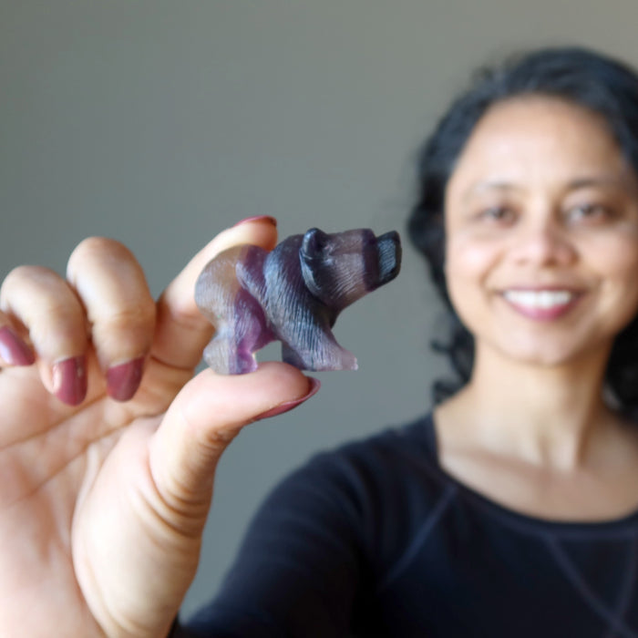 sheila of satin crystals holding  Carved Rainbow Fluorite Bear Statue