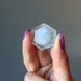 holding fluorite hexagon cabochon crystal