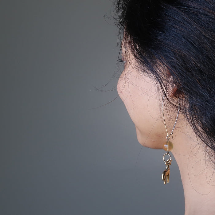 woman modeling fluorite giraffee earrings