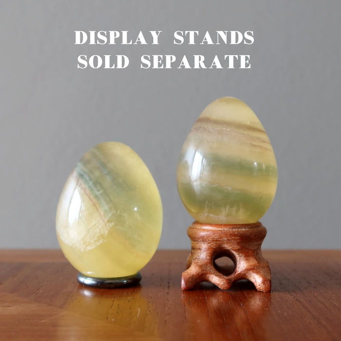 two Yellow Fluorite Eggs on stands