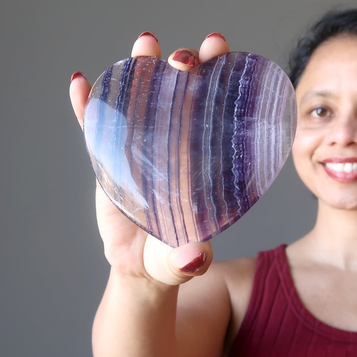 sheila of satin crystals holding Purple Fluorite Heart