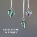 displaying 3 Rainbow Fluorite heart shape pendants hangs on sterling silver chains