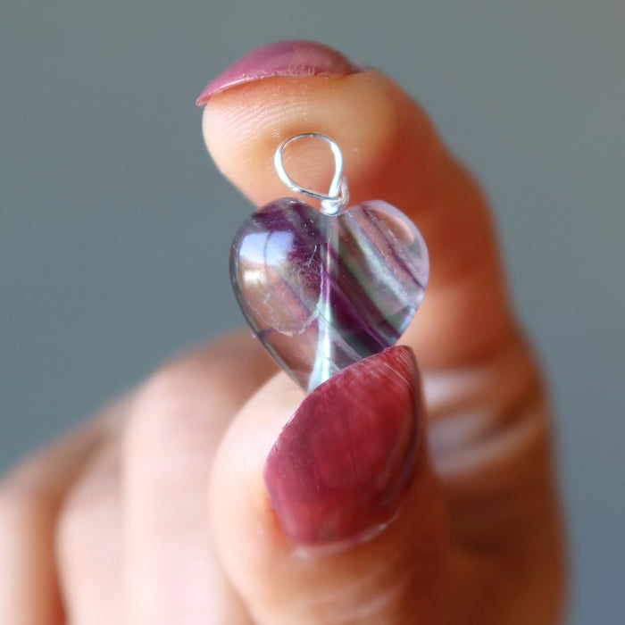 holding Rainbow Fluorite heart shape pendant