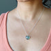 female model wearing blue Fluorite heart pendant hangs from a sterling silver chain 