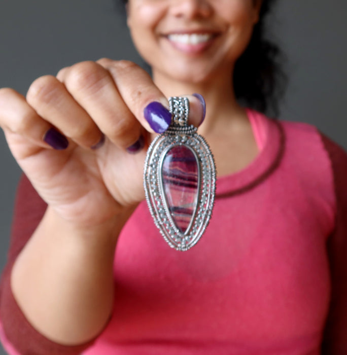sheila of satin crystals holding Sterling Silver Purple Teardrop Fluorite Pendant