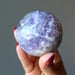 holding Lavender Fluorite Sphere 
