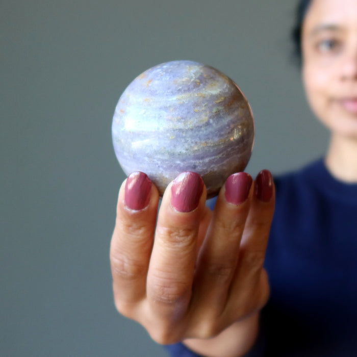 holding Lavender Fluorite Sphere 