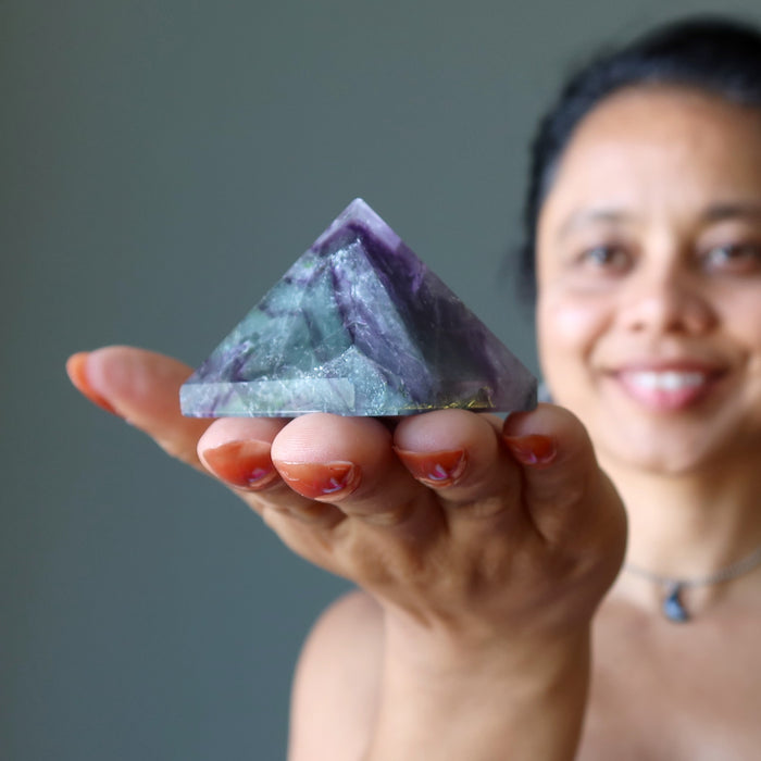 sheila of satin crystals holding Green Purple Fluorite Pyramid 