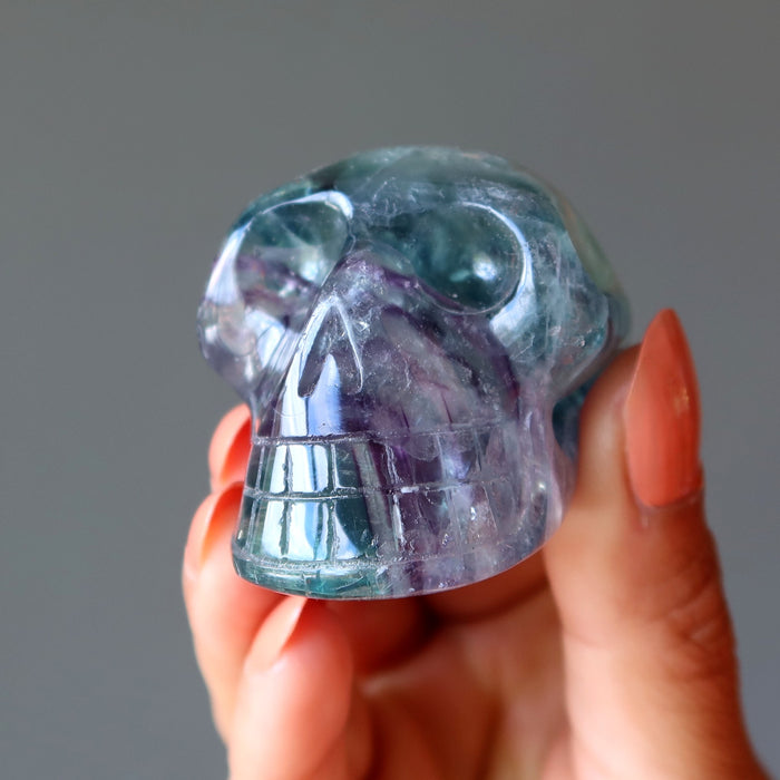 holding green purple rainbow Fluorite Skull