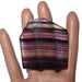 on mannequin palm displaying House Shaped Purple Fluorite Polished Stone 
