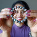 woman holding kashgar garnet bracelet