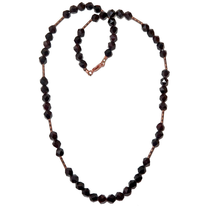 faceted polygon Garnet beaded Necklace strung with copper tube beads secured with a copper lobster claw clasp