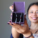 sheila of satin crystals holding Garnet Earrings in the purple gift box