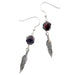 sterling silver feather shapes hung on the faceted red garnet hook earrings