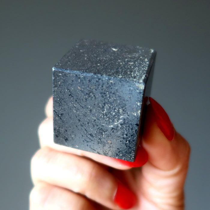 hematite cube in hand
