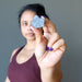 woman holding raw hematite stone