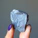 hand holding raw hematite stone