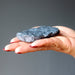 raw specular hematite stone in hand