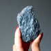 raw specular hematite stone in hand