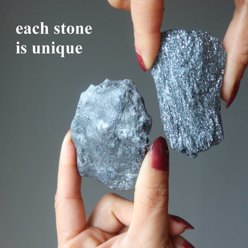two raw specular hematite stones