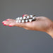 female hand howlite coil bracelet in palm
