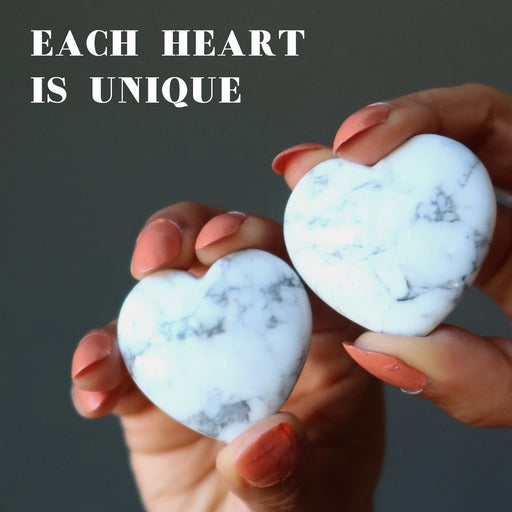 holding 2 Howlite Hearts one on each hand