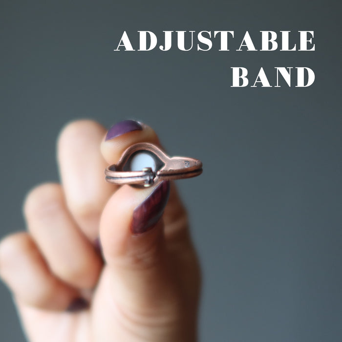 hand wearing howlite ring showing adjustable band