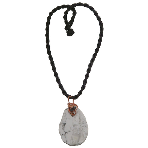 freeform Howlite slab necklace wrapped in copper wire with a black and gray Snowflake Obsidian donut amulet pendant hangs from a satin-finished nylon twist necklace secured with a knot clasp.