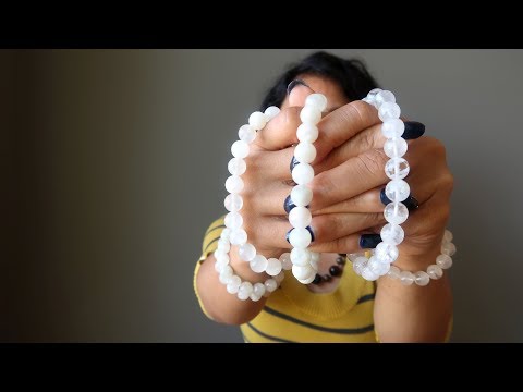 video about white rainbow moonstone beaded stretch bracelets