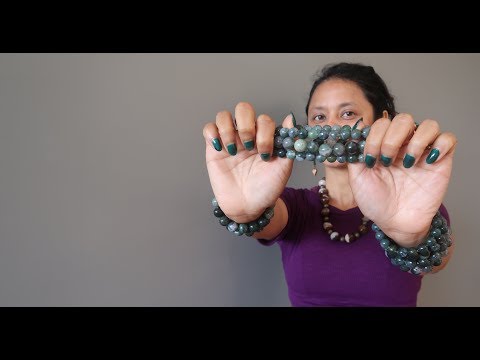 video about wearing green and white moss agate round beaded stretch bracelets