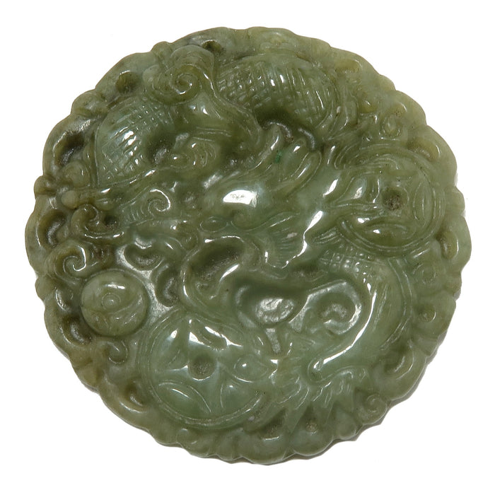 green jadeite amulet carved with dragon and money coins