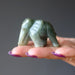 green jade elephant carving on palm