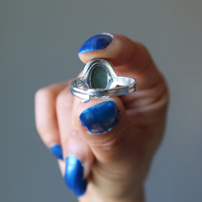 showing the back of nephrite jade oval in sterling silver ring