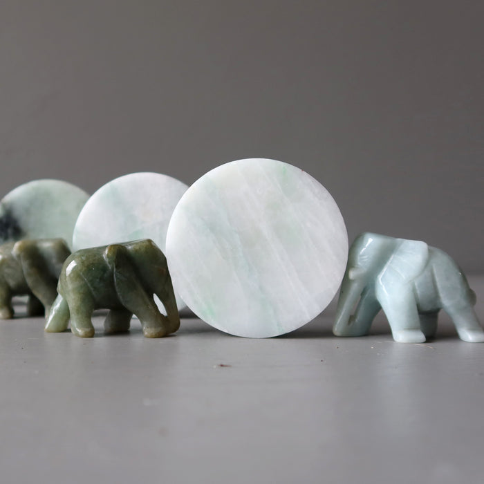 jade elephants head butting jade circle slabs
