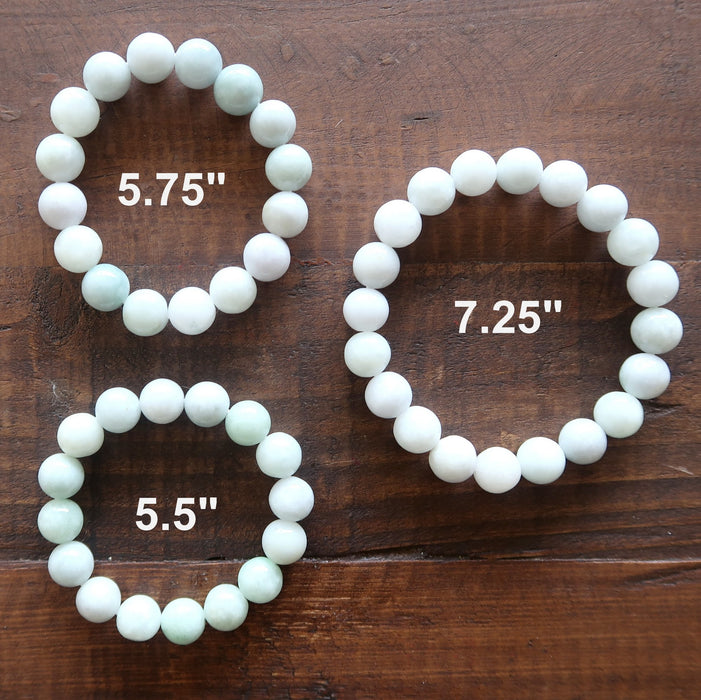 3 white jade round beaded stretch bracelets showing different lengths