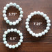 3 white jade round beaded stretch bracelets showing different lengths
