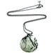drop shaped creamy Jasper stone with a hint of green and full of black dendritic inclusions pendant hangs from a gunmetal ball chain secured with a lobster claw clasp
