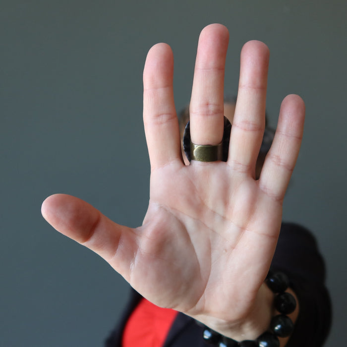 female wearing a big dendritic jasper ring showing backside