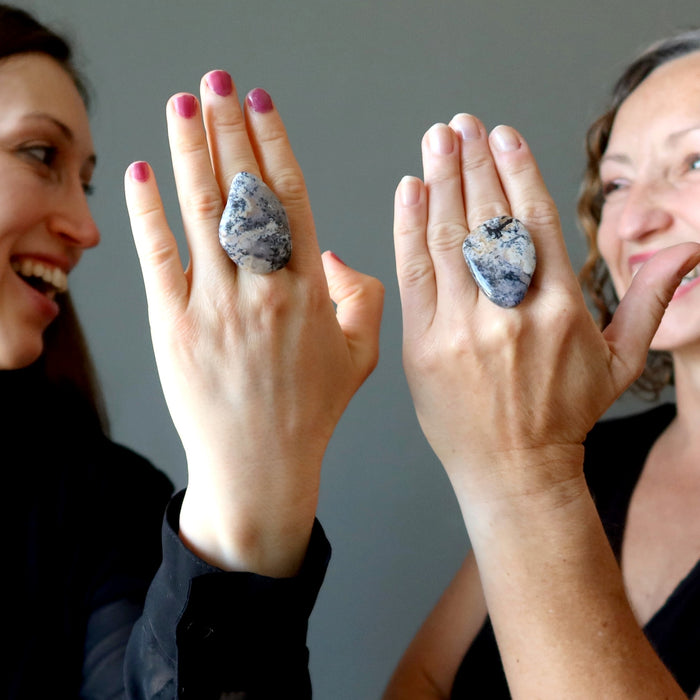 two females wearing a big dendritic jasper ring